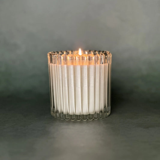 Leveiza luxury scented soy candle in clear ribbed glass vessel