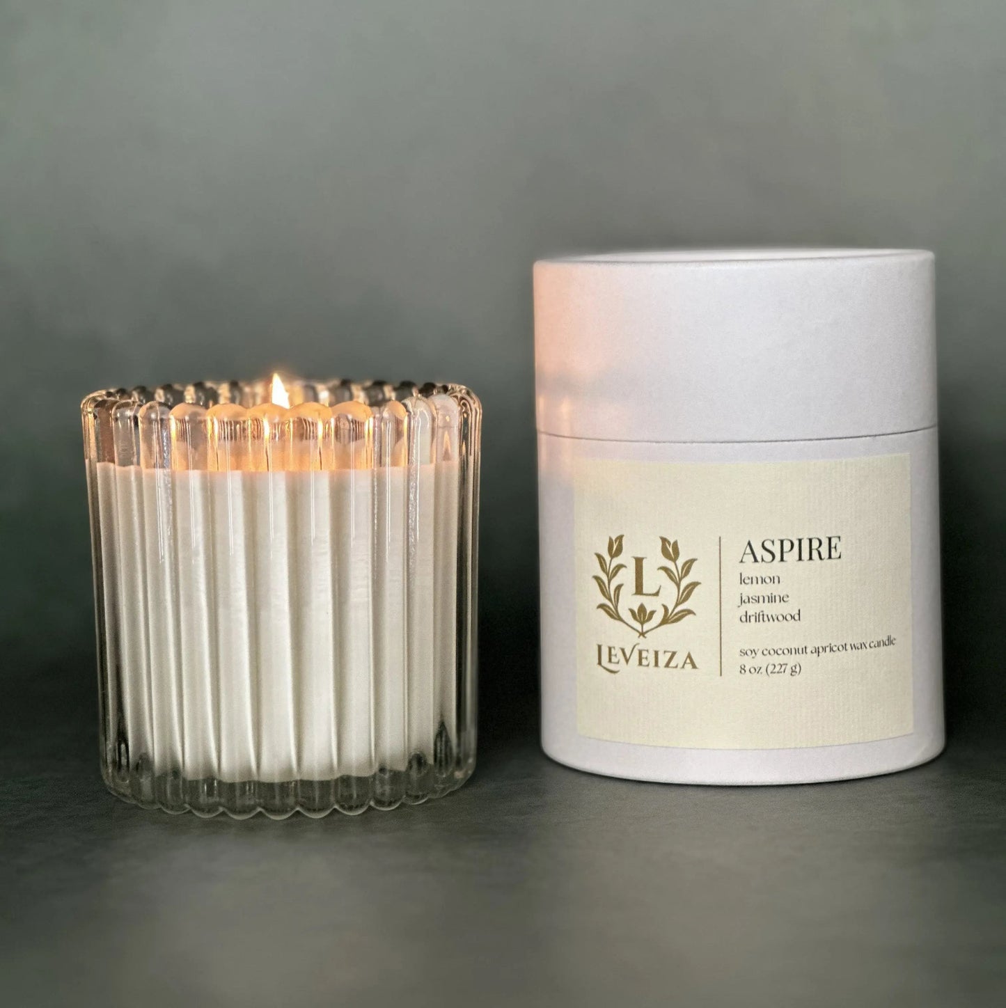 Aspire luxury soy candle with white tube packaging by Leveiza