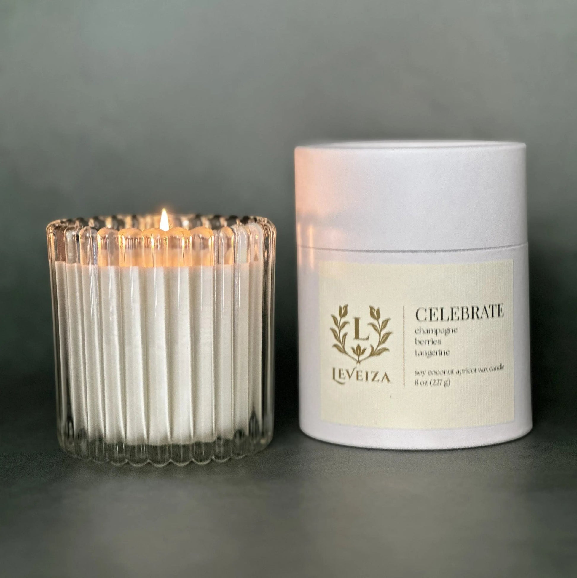 Celebrate luxury soy candle with white tube packaging by Leveiza