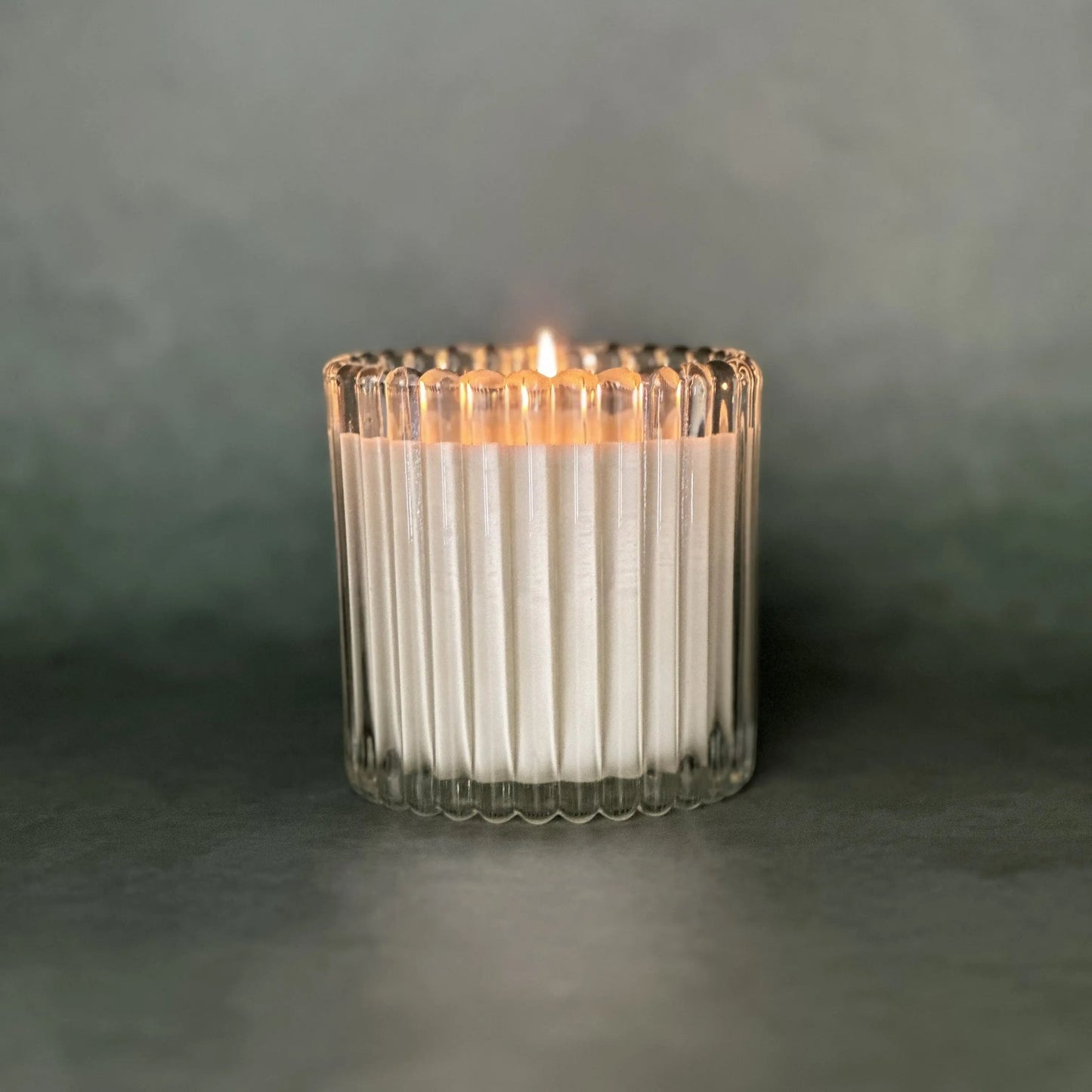 Create luxury soy candle in clear ribbed glass vessel by Leveiza