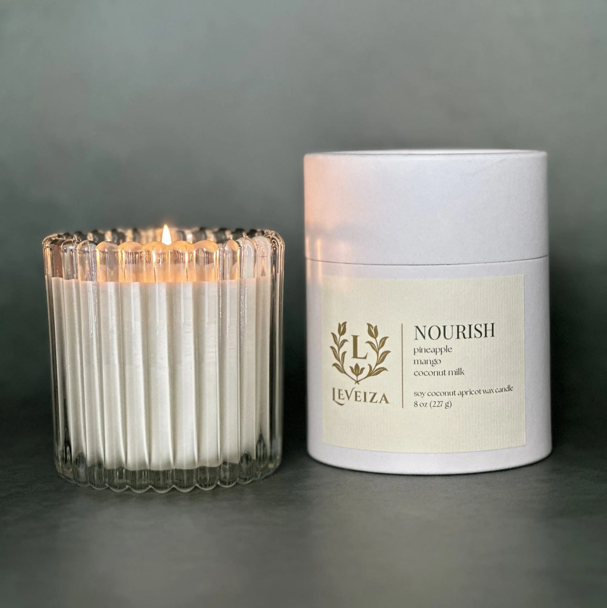Nourish luxury soy candle with white tube packaging by Leveiza