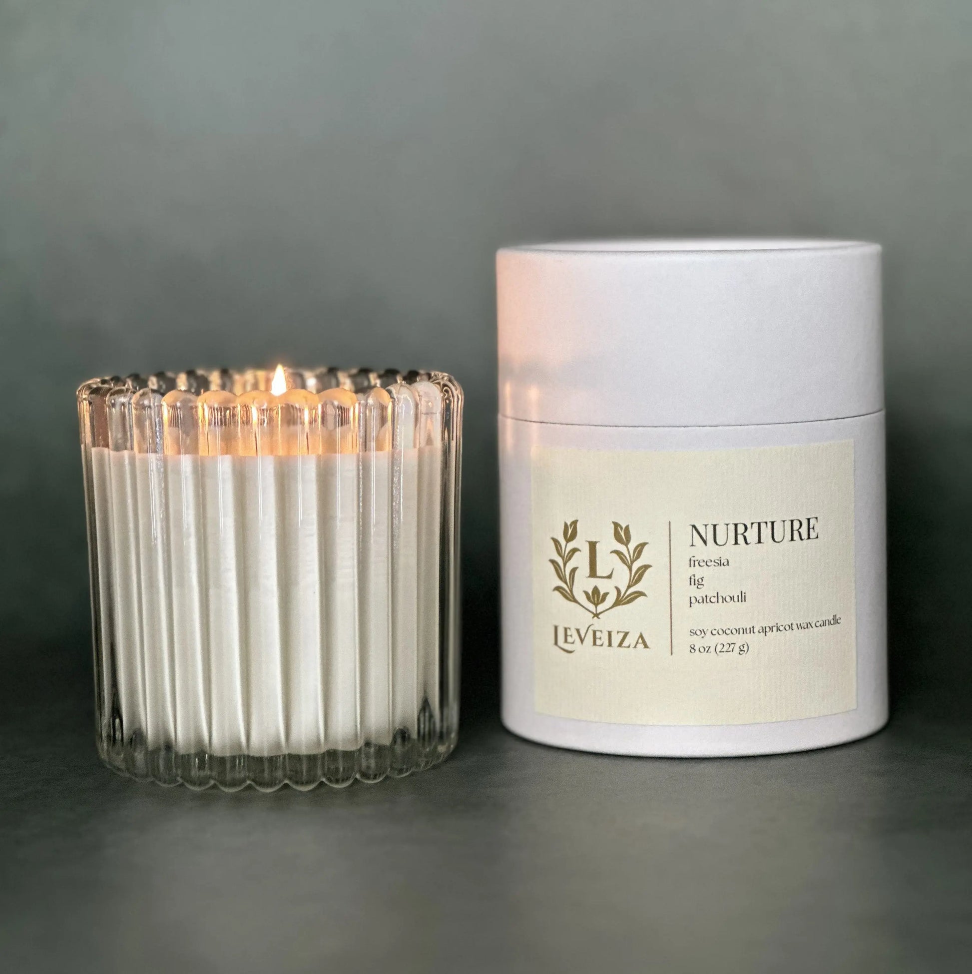 Nurture luxury soy candle with white tube packaging by Leveiza