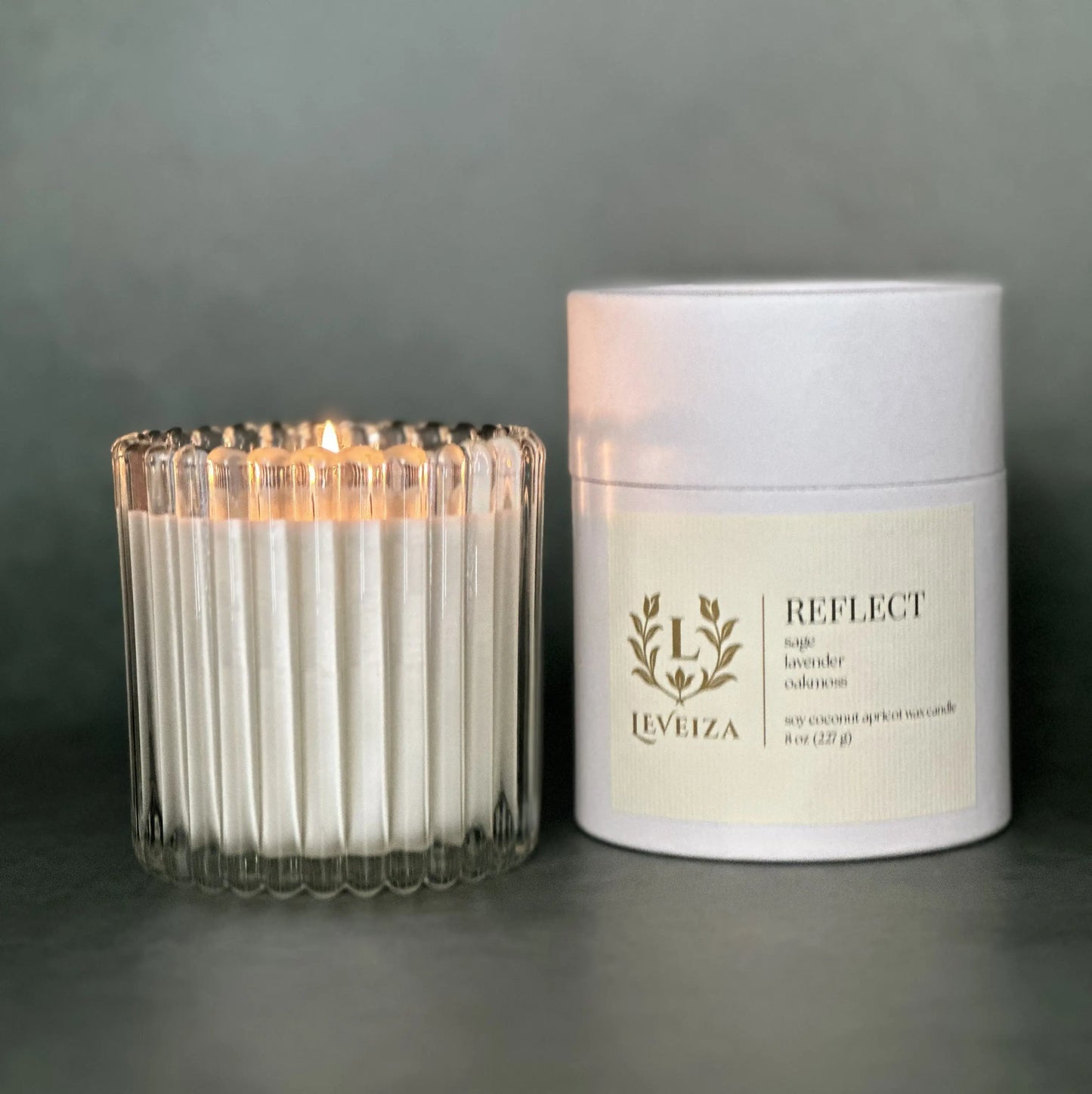 Reflect luxury soy candle with white tube packaging by Leveiza