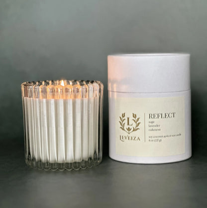 Reflect luxury soy candle with white tube packaging by Leveiza