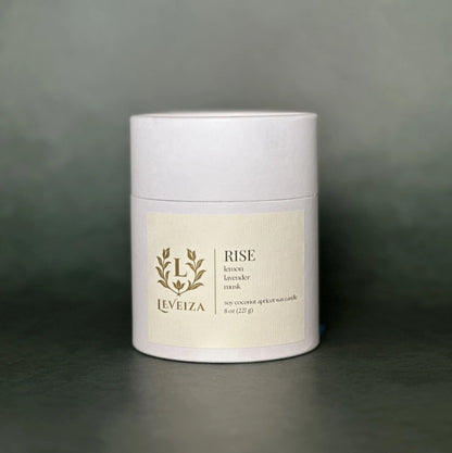 Leveiza Rise candle white tube packaging with lemon lavender musk scent notes