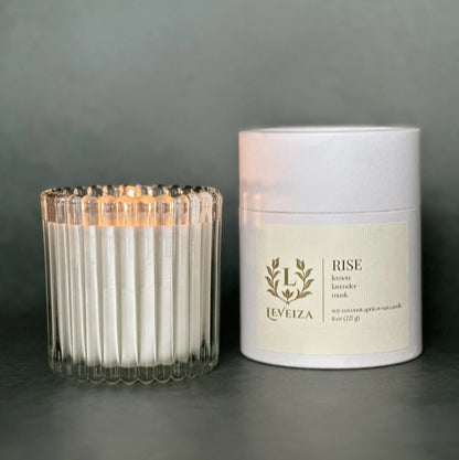 Rise luxury soy candle with white tube packaging by Leveiza